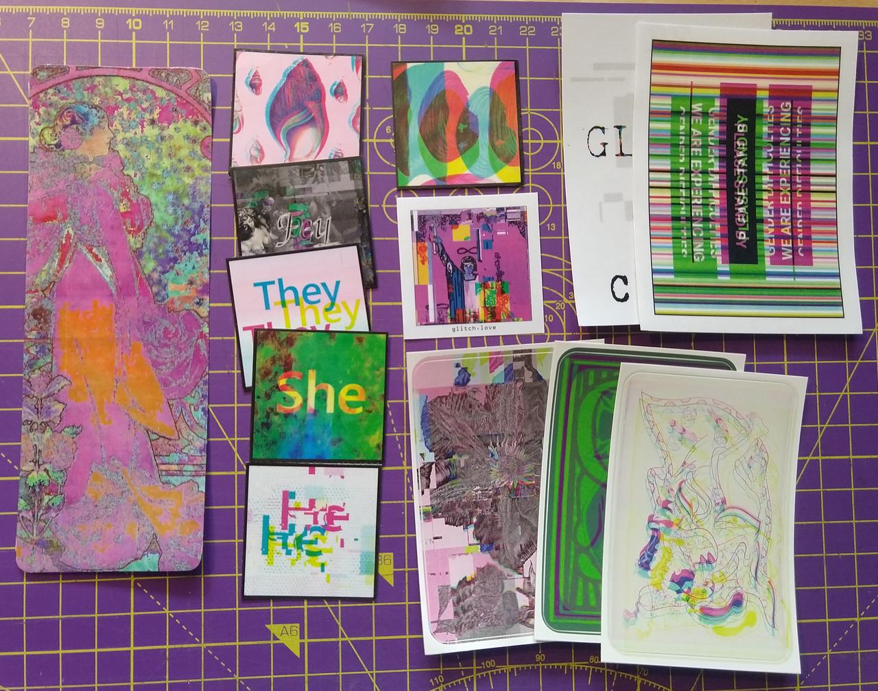 colourful glitchart stickers of various sizes spreat out on a cutting